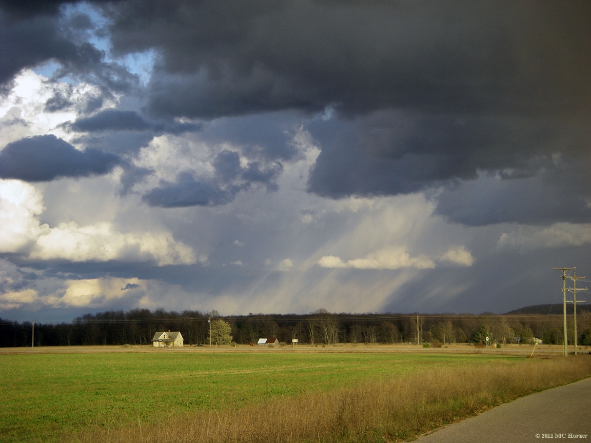 Near Alba, Michigan. Lake effect cloud trains.