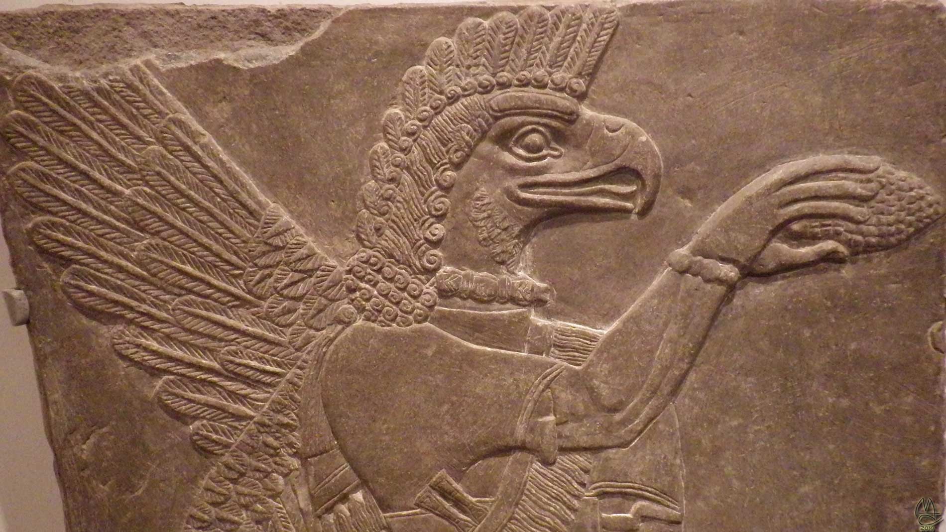 Assyrian winged god scrapes sap from a sacred palm with a pinecone. 883-859 BCE