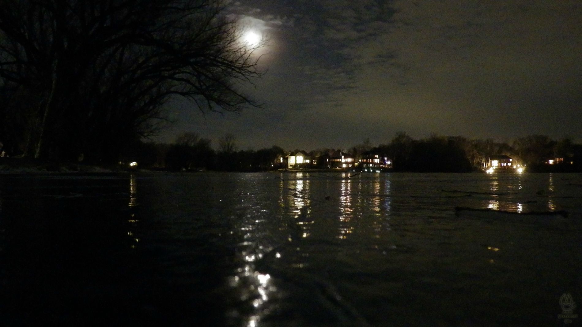 Moon over frozen lake.