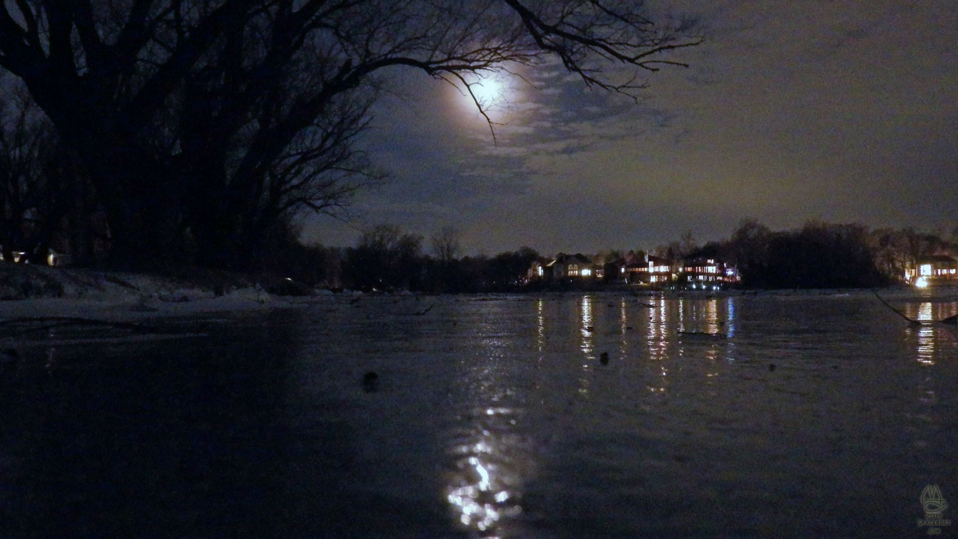 Moon over frozen lake.