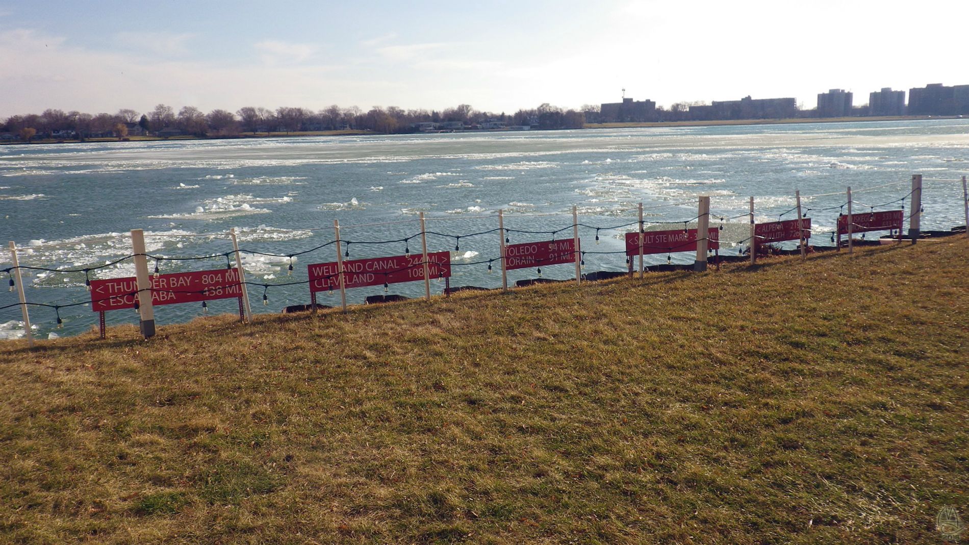 Current downstream, wind upstream, ice in the middle. Canadian shore opposite.