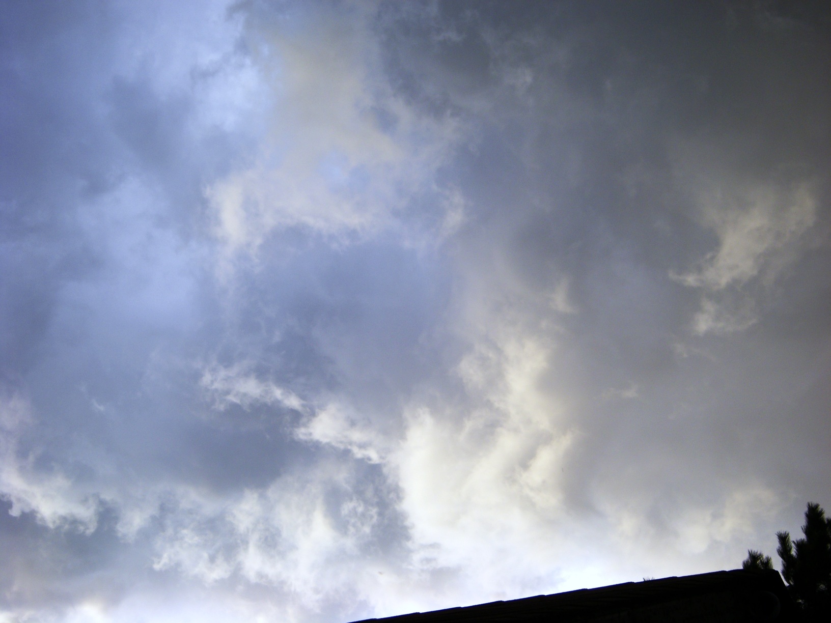 Swirling above the roofs.