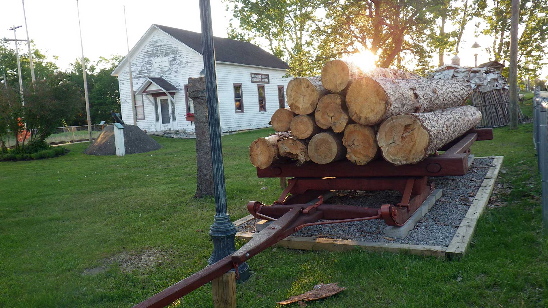 Restored log sled retrieved from local lake bottom decades after it went thru the ice.