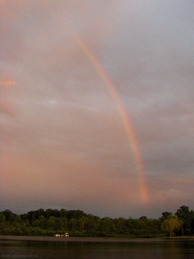 Rainbow as the sun sets on Commerce Lake MI.