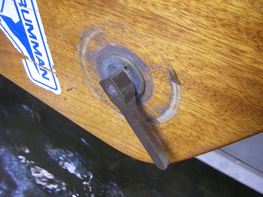 Clamp handle, leeboard in raised and locked position.