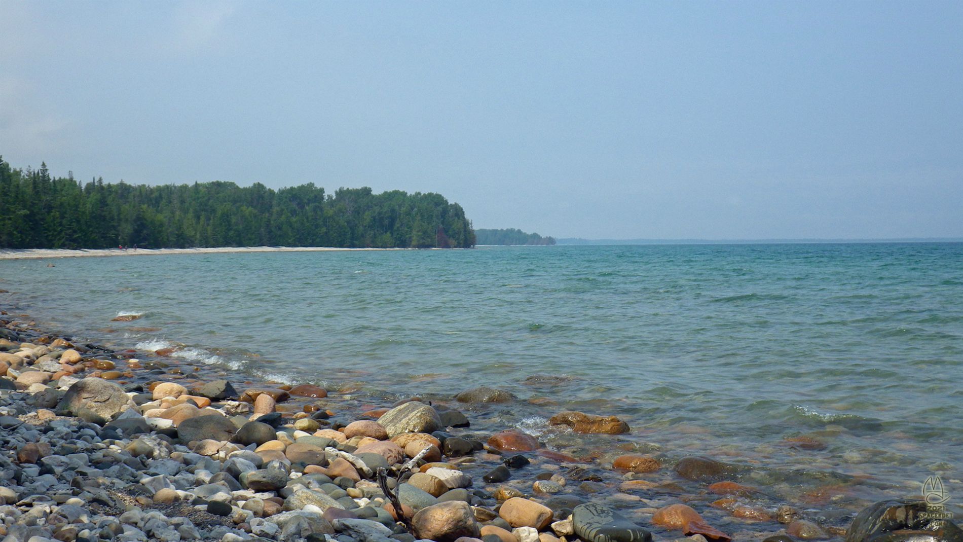 Rocky shore and distant points.