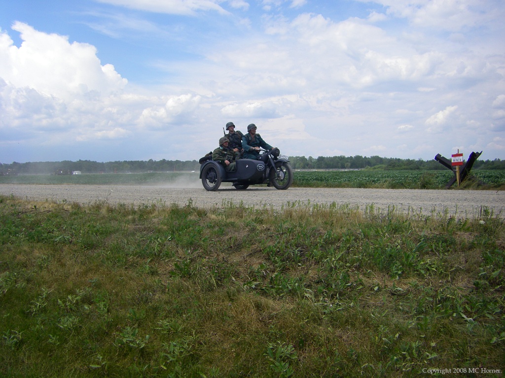 Sidecar Motorcycle; Ground battle re-enactors in action.