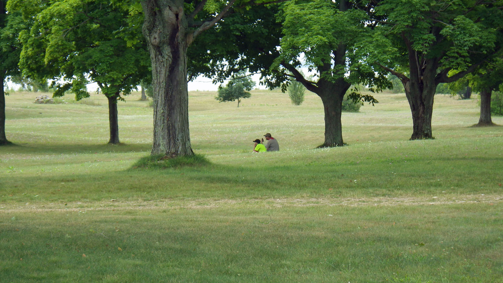 Hikers survey the village.