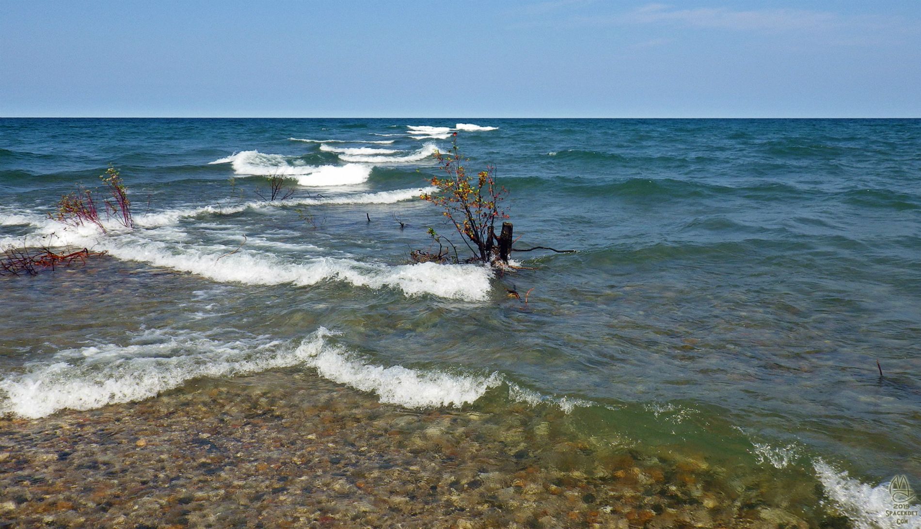 Waves criss-crossing on the shoal at the tip of the point.