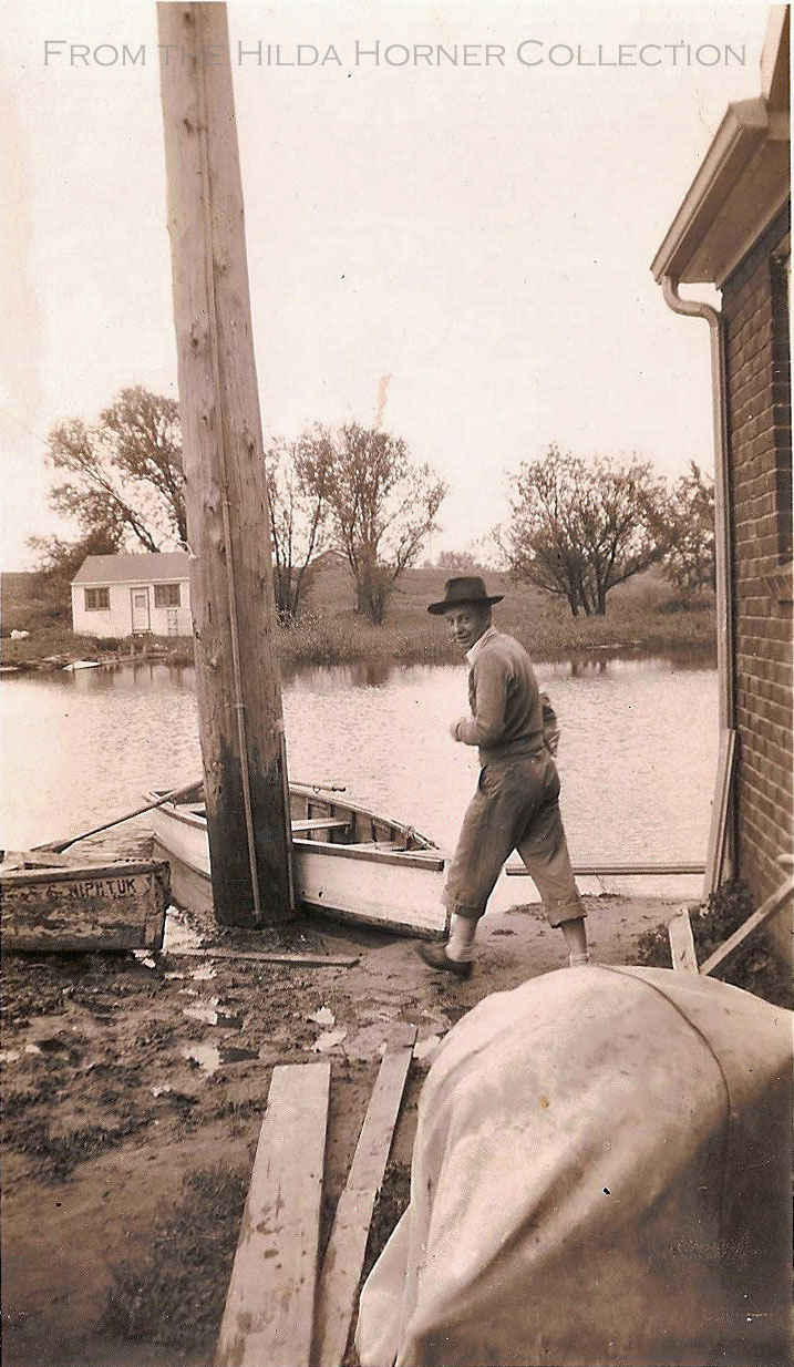 Commerce Lake, Michigan. 1941 Results of the flood on Junior Canal Street. Love the old wooden rowboats.