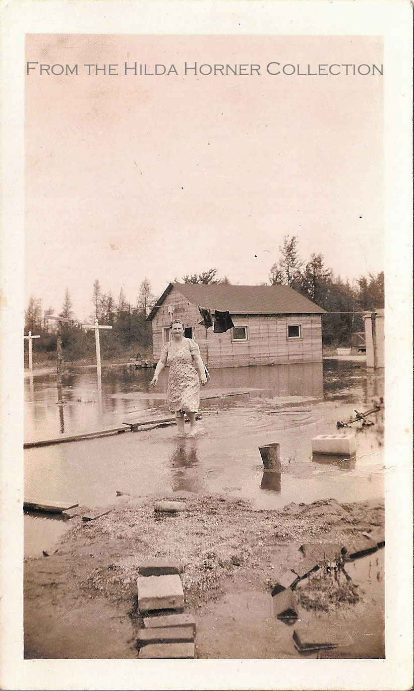Commerce Lake, Michigan. 1941 Results of the flood on Junior Canal Street. Laundry still needed to be done, no matter what!